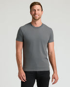 Man wearing the Staple Classic Crew Neck T-shirt, fitted and gray.