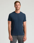 Man wearing The Staple Classic Crew Neck 6-Pack navy T-shirt.